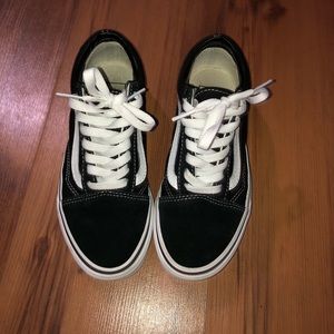 Black and white low top vans